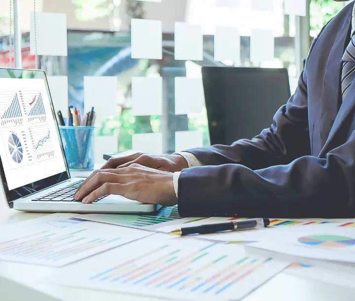 Executives discussing technology investment reports